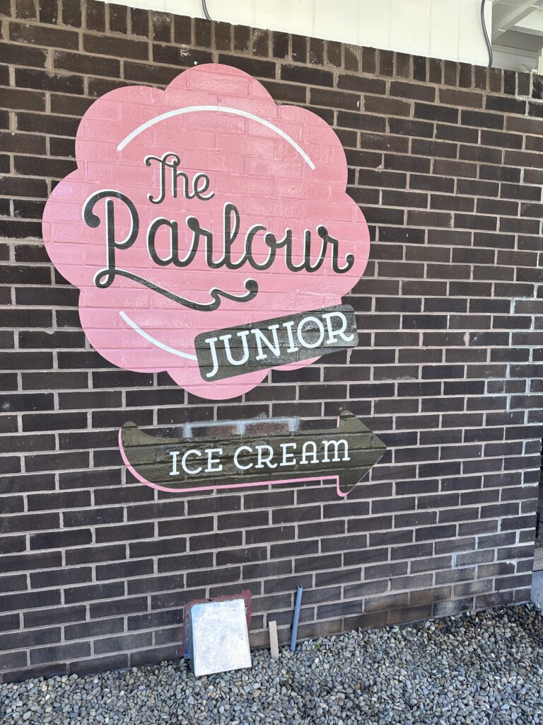 The Parlour Junior sign