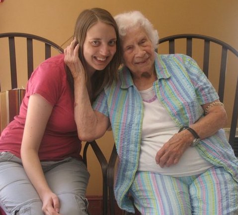 Grandma and grandaughter posing for picture